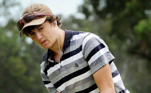 Ryan Duke only has eyes for his ball as he rolls a putt towards the hole during his round in the Open. Ryan Duke only has eyes for his ball as he rolls a putt towards the hole during his round in the Open.